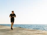 man running by the sea in the morning