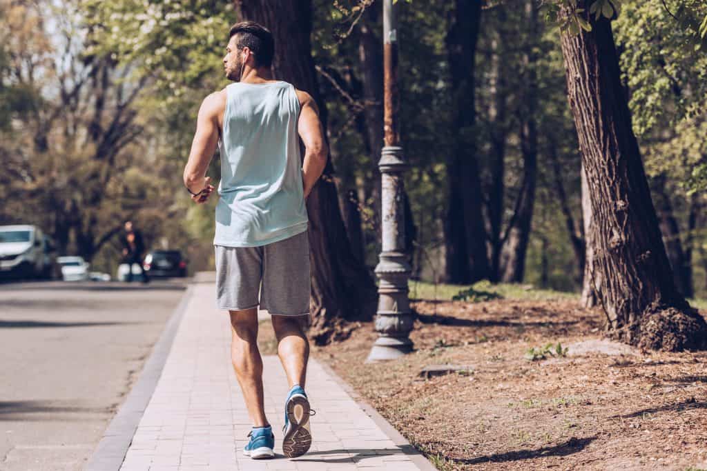 How to Prepare for a 5k in 14 Weeks:back of a man jogging outdoors