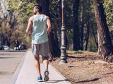 back of a man jogging outdoors