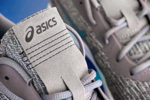 best ASICS for plantar fasciitis : Close-up of new gray Asics running shoes. Studio shot.