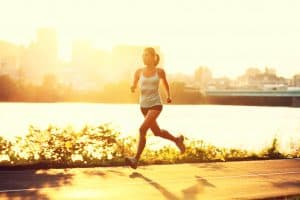 woman running at golden hour