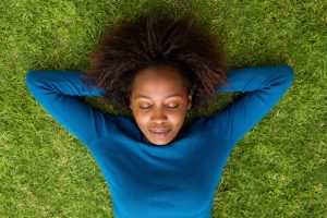 woman lying on grass sleeping