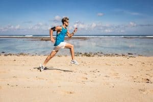 How Many Calories Do You Burn Running for an Hour?: man running on a beach
