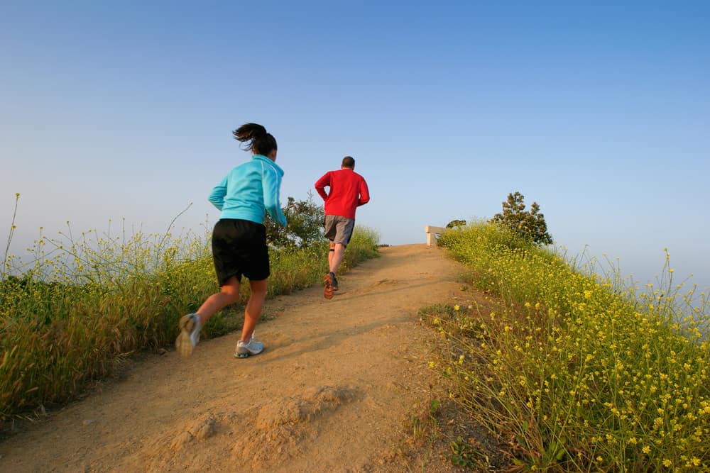 Two people running at Runyon Canyon Park, Hollywood Hills, California USA