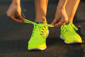 Running shoes being tied