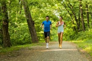 Young people jogging and exercising in nature