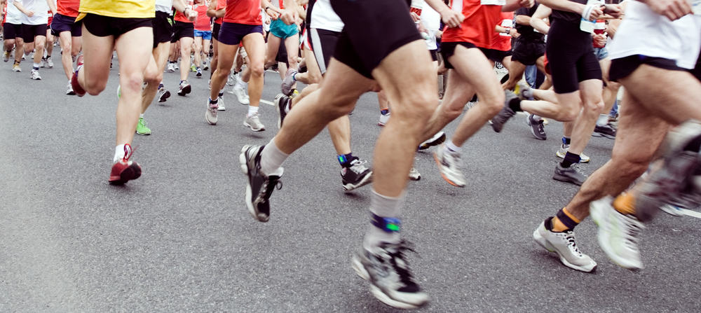 sub 30 5k: Runners running in marathon race in city