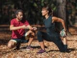 Woman stretching in park before training