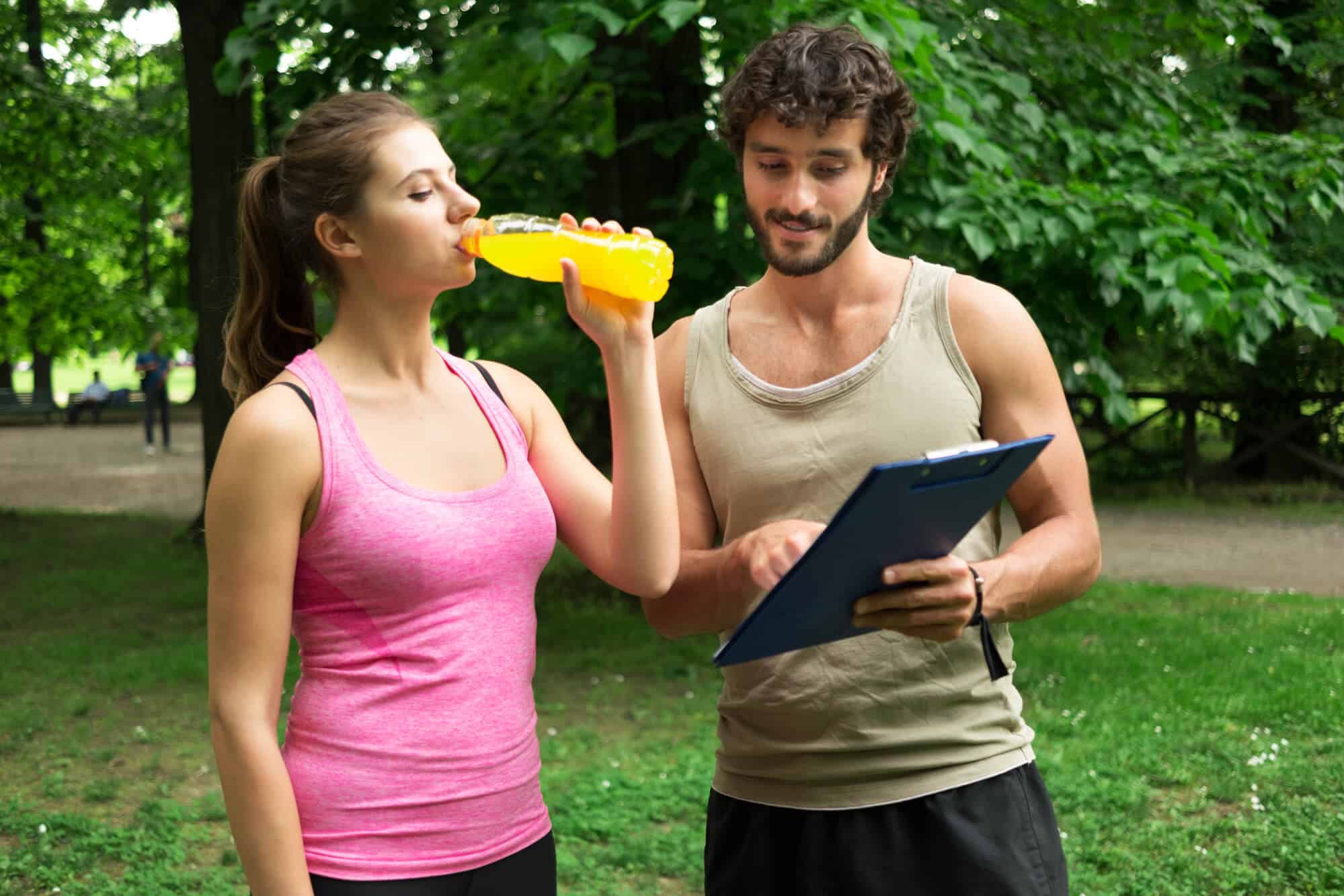 How Many Weeks Before a Marathon Should I Taper:Man showing training program to woman